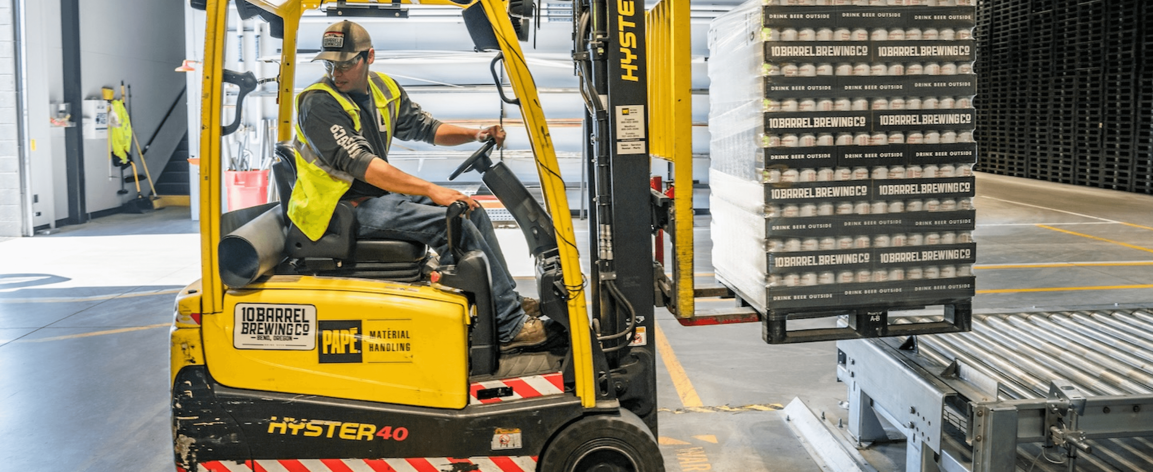 Employee driving a forklift